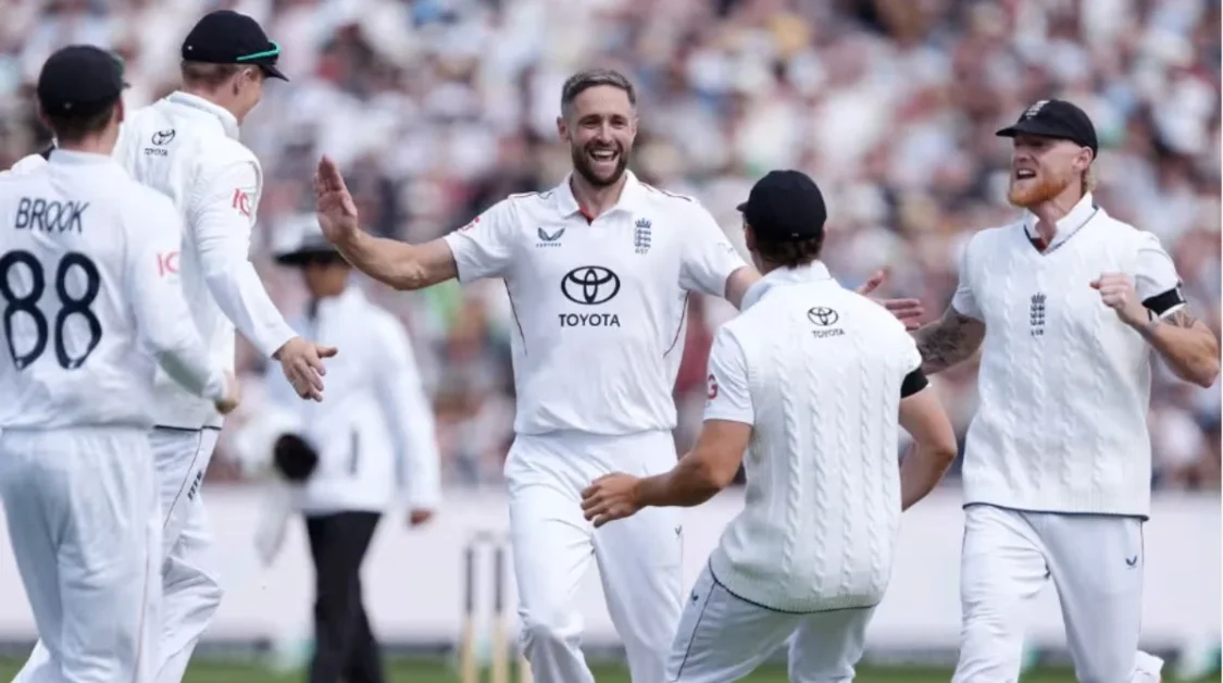 England cricket players celebrate a wicket during a Test match.