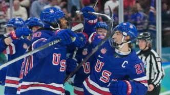 hilaryknight celebrates Team USA overtime gold medal win during Olympic women’s hockey final on the ice