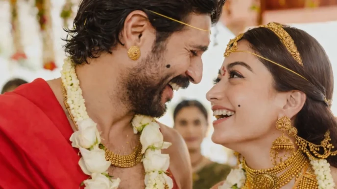 Rashmika Mandanna in traditional wedding jewelry smiling in a close-up romantic ceremony moment