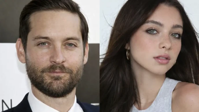 Side-by-side close-up portrait of a Toby Maguire in a navy suit and a young woman with long dark hair wearing a light gray sleeveless top