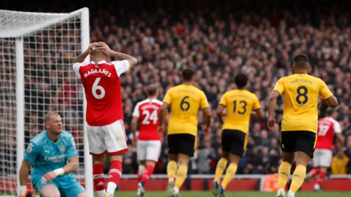 Wolves vs Arsenal players react near the goal during a tense Premier League match moment with no faces visible
