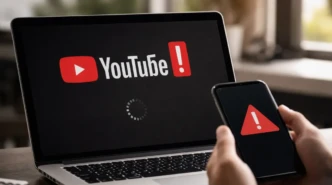 YouTube outage displayed on laptop and smartphone screens showing loading error during widespread service disruption