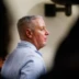 Colin Gray verdict courtroom photo showing a man in profile during trial proceedings, blurred gallery foreground.